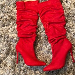Red thigh high boots. NEVER WORN